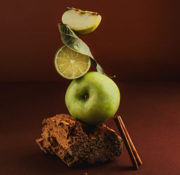 Balancing ingredients apple, cinnamon, lime. levitation. Conceptual food. Modern design. Balancing ingredients apple, cinnamon, lime. levitation. Conceptual food. Modern design.