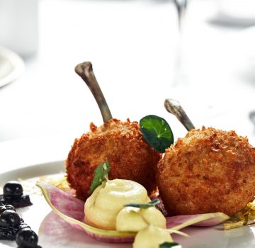 Chicken Kiev or Fried Chicken Kiev, fried in bread crumbs, Beautiful creative food design on a white Chicken Kiev or Fried Chicken Kiev, fried in bread crumbs, Beautiful creative food design on a white