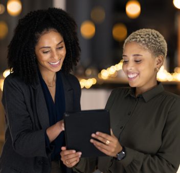 Tablet, black woman and social media manager at a digital marketing agency coworking on a branding Tablet, black woman and social media manager at a digital marketing agency coworking on a branding